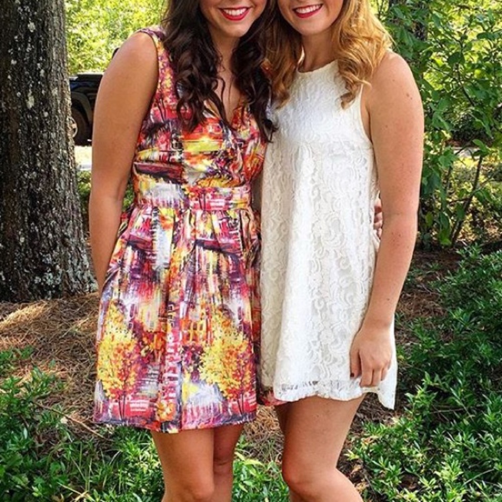 Abstract, colorful dress (left)